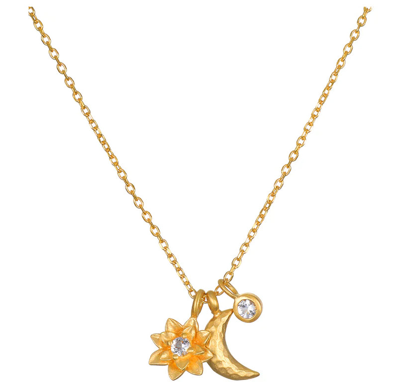 Protected by the goddess moon, we are free to transform into our most authentic selves. An 18kt gold plated necklace is adorned with a lotus flower, a crescent moon, and a white topaz star, inspiring new beginnings, offering protection and goddess energy,