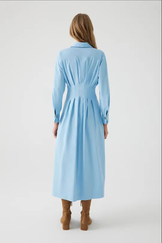 The Waist-Fitted Button-Detail Cotton Midi Shirt Dress effortlessly blends style and comfort with its natural cotton fabric, providing comfort all day long. The front button details and waist-fitted silhouette create a sleek and modern look. Ideal for bot